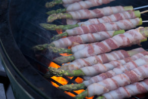 Bacon Wrapped Asparagus Yakitori over flames on Big Green Egg
