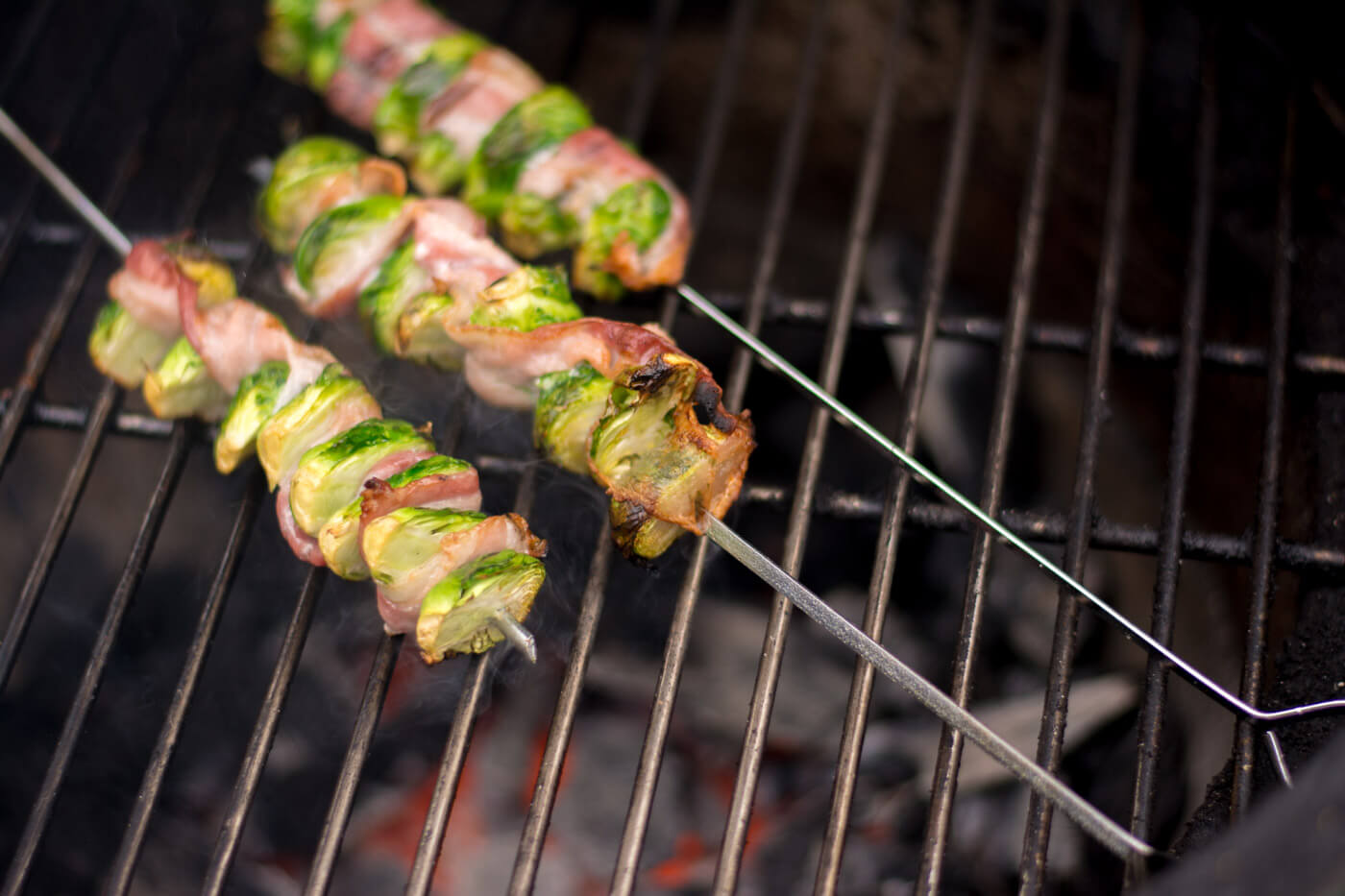Brussel Sprout kabobs over a direct heat from the grill and turning toasty brown.