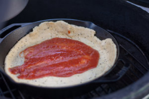 Adding Sauce for Grilled Cast Iron Pizza