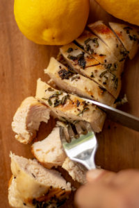 Grilled Rosemary Thyme Chicken Breast Sliced on the Cutting Board
