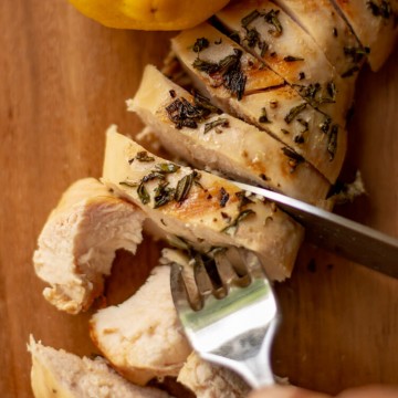 Grilled Rosemary Thyme Chicken Breast Sliced on the Cutting Board