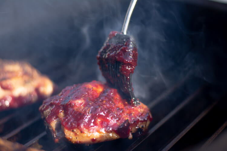 Thickly applied Cherry Glaze to the Chicken on the Big Green Egg
