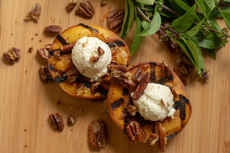 Grilled Peaches with Honey Goat Cheese and Sprinkled with Pecans