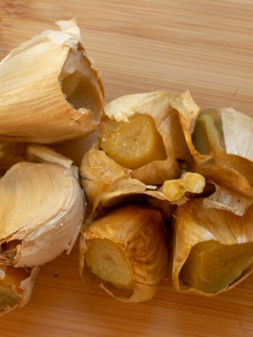 Grilled Roasted Garlic on a Cutting Board