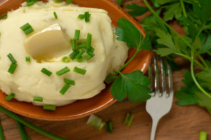 Melted Butter on the Roasted Garlic Mashed Potatoes with Cream Cheese