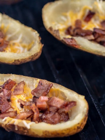 Cheese and Bacon Bits are Bubbling on the Potato Skins on the Big Green Egg.