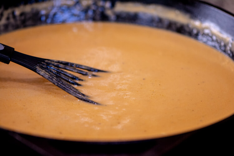 Stir the beer and cheese together until it is fully melted and creamy. It will thicken