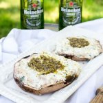 two large portobello mushrooms stuffed with a creamy ricotta cheese and topped with a pesto