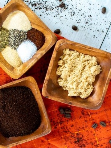 Three wooden containers with spices and seasonings to make this java rub