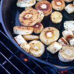 golden brown sliced and peeled parsnips on the grill