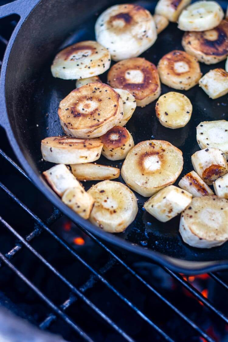golden brown sliced and peeled parsnips on the grill
