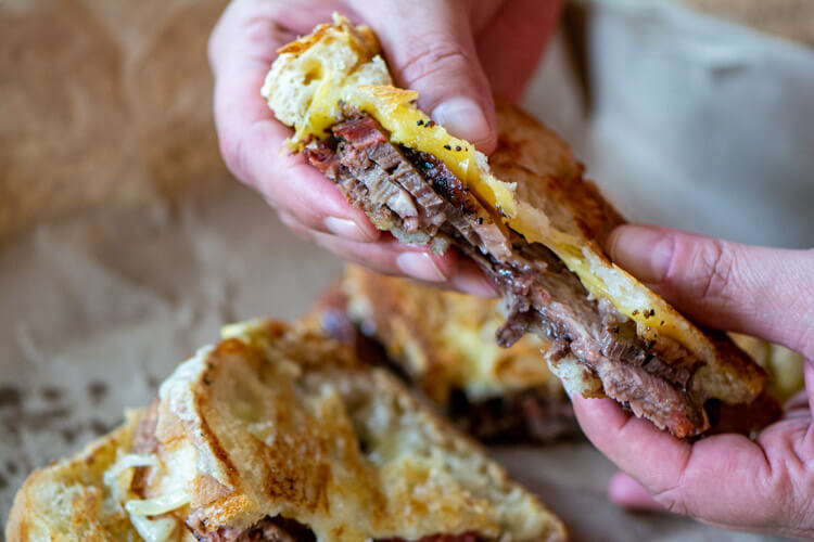 sliced brisket and cheese are the stars of this brisket grilled cheese sandwich