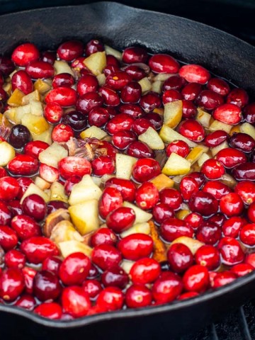 smoked apples and oranges in the cranberry mix in a cast iron skillet on the grill.