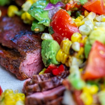 grilled and sliced flank steak topped with freshly chopped veggies.
