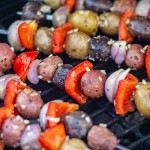 potatoes, shallots and red peppers on kabobs and coated with a garlic mixture on the grill.
