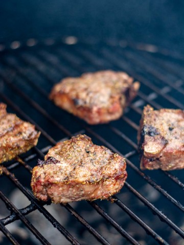 lamb chops on the grill grate.
