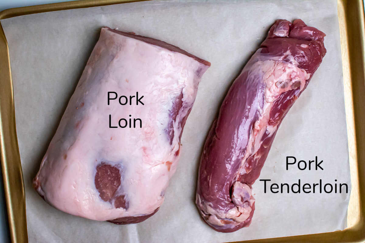 pork loin and tenderloin on a sheet pan to show the difference between these two cuts of meat.