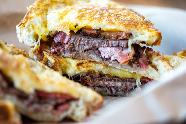 brisket grilled cheese sandwich sliced.