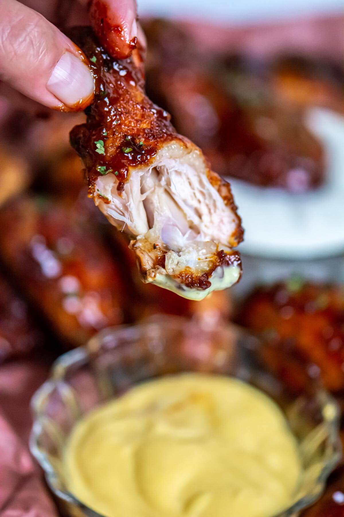 smoked chicken wings over a honey mustard dipping sauce.