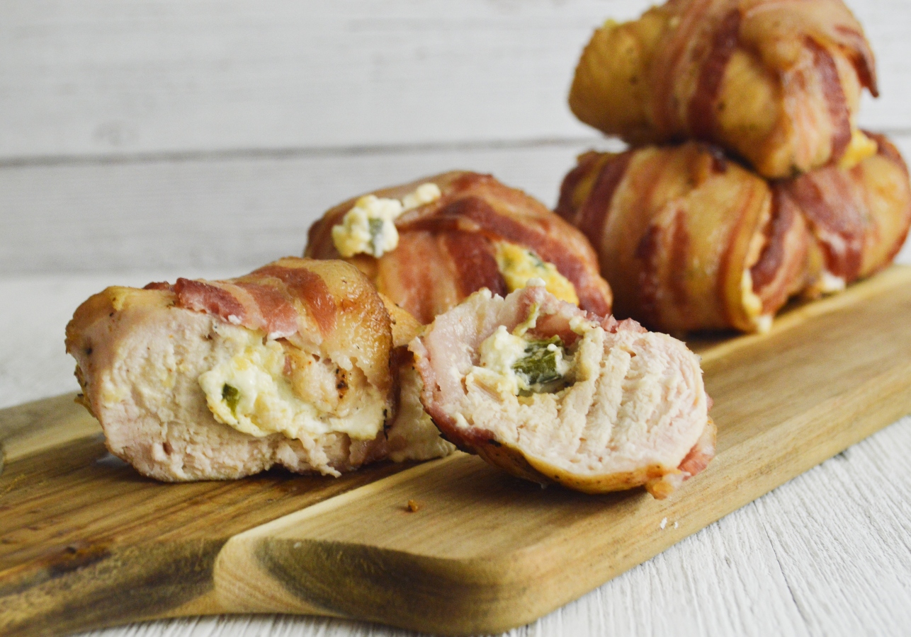 Smoked chicken stuffed with peppers and cheese and wrapped in bacon are perfect for the smoker.