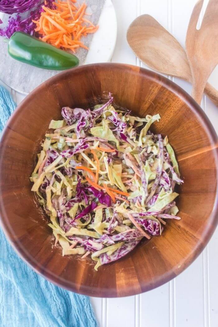 spice coleslaw in a wooden bowl