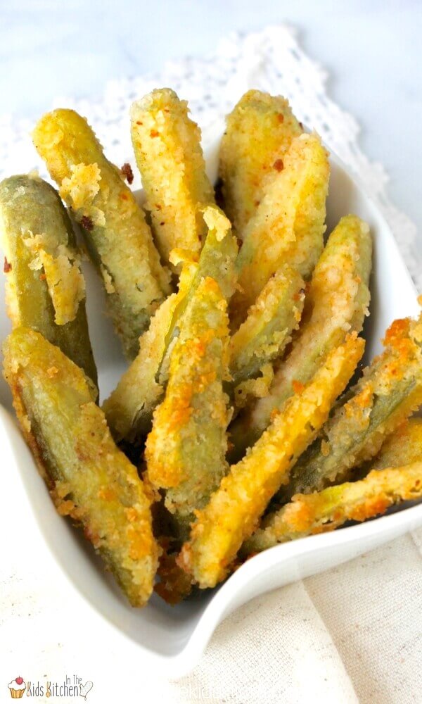 white bowl with fried pickles in it.