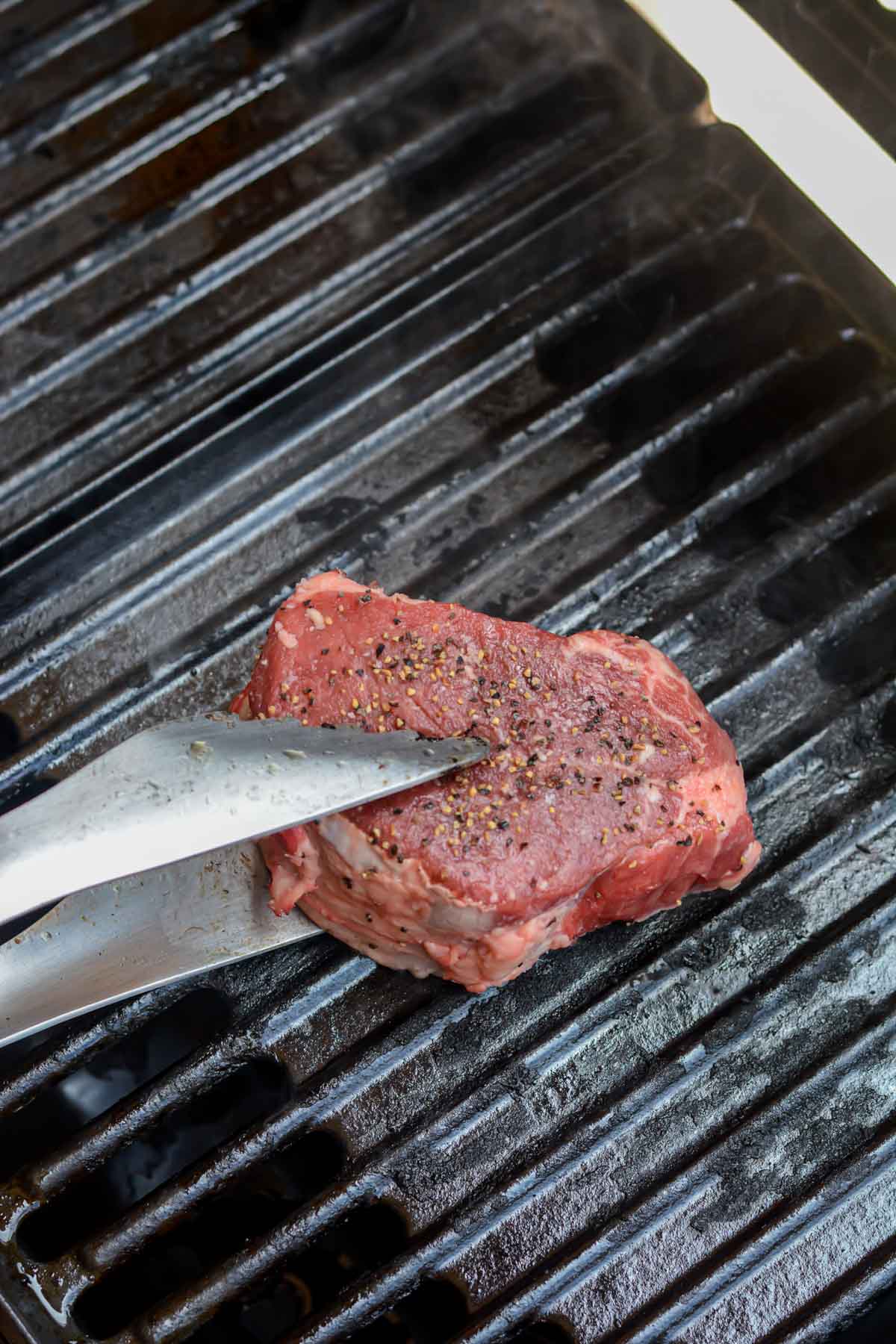Adding a steak to a grill that costs less than $300.