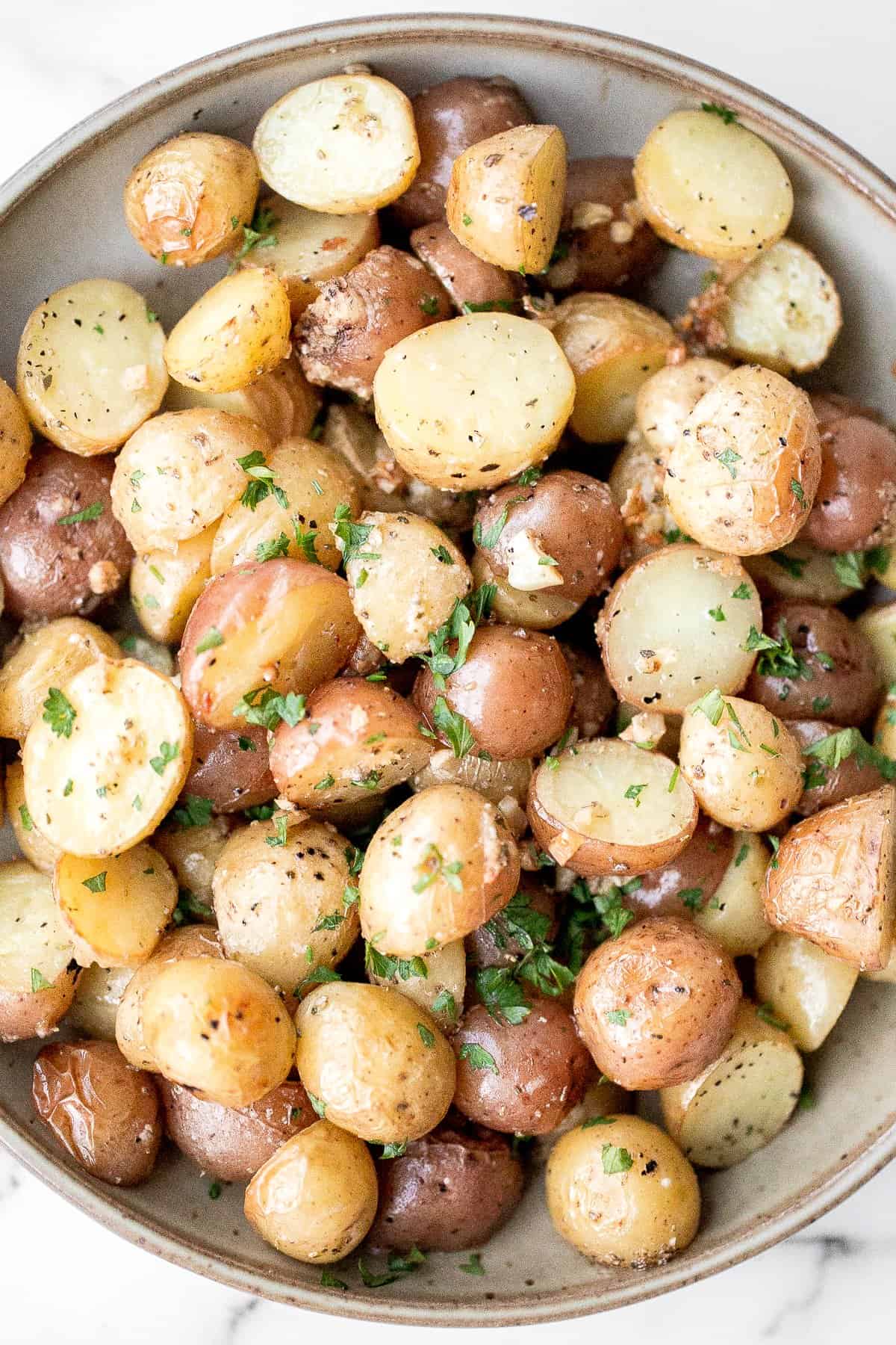 baby potatoes cut in half and cooked with garlic and herbs. 