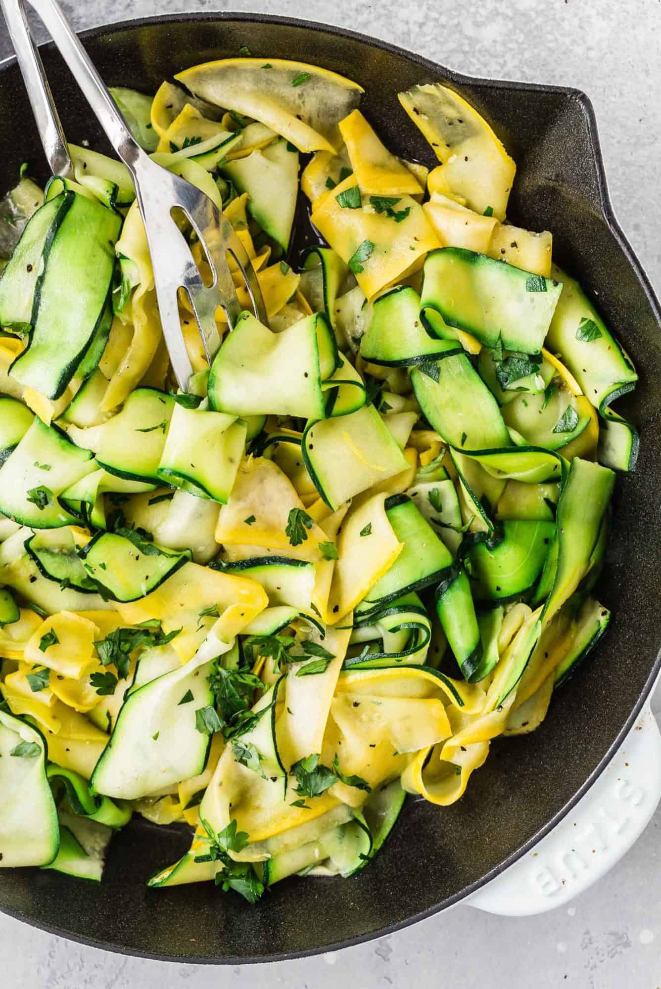 thinly sliced zucchini in a pan. 