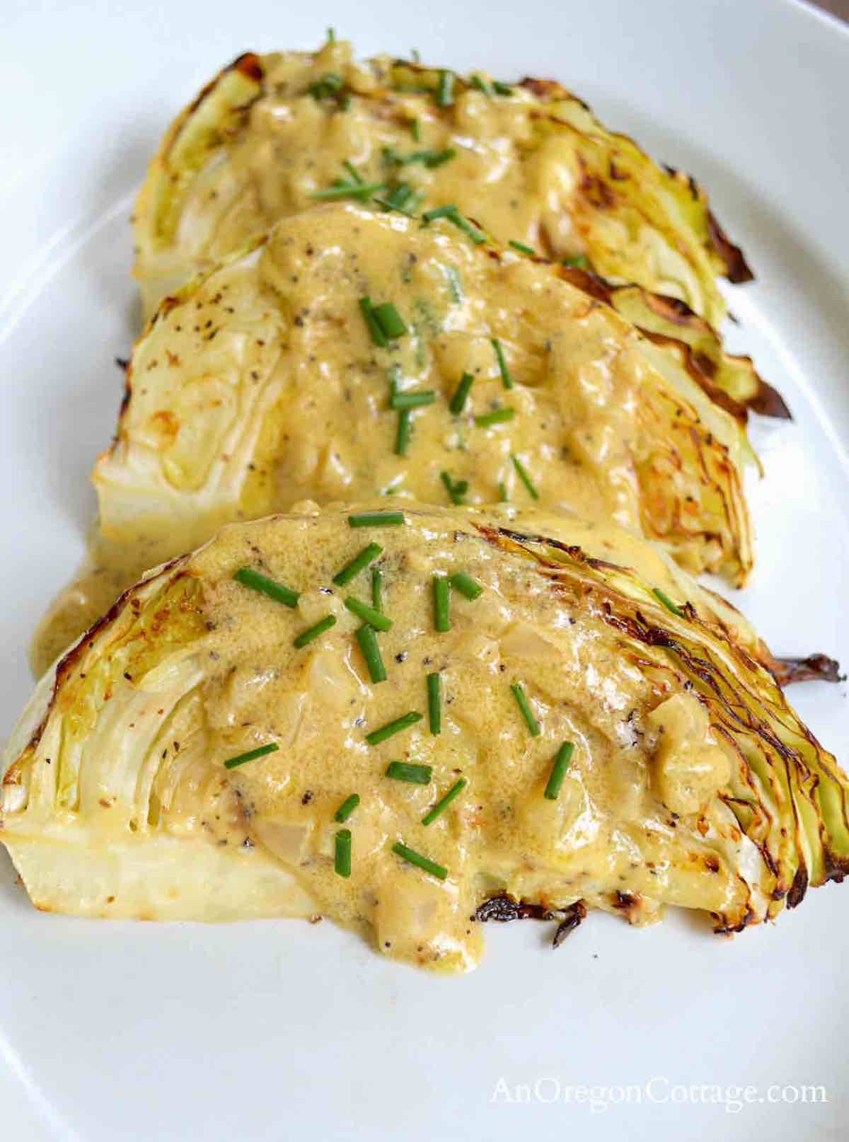 sliced cabbage with a sauce drizzled on top.