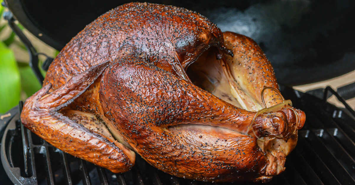 Smoked whole turkey on the grill.