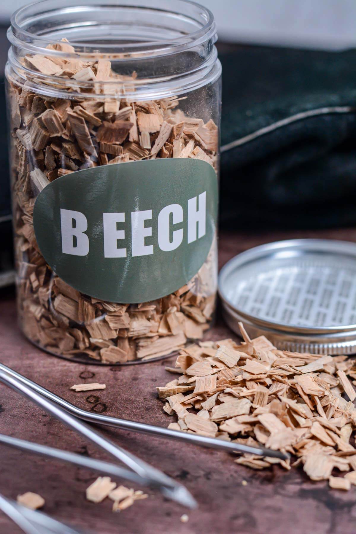 jar of beech wood ships with grilling tools on the table.