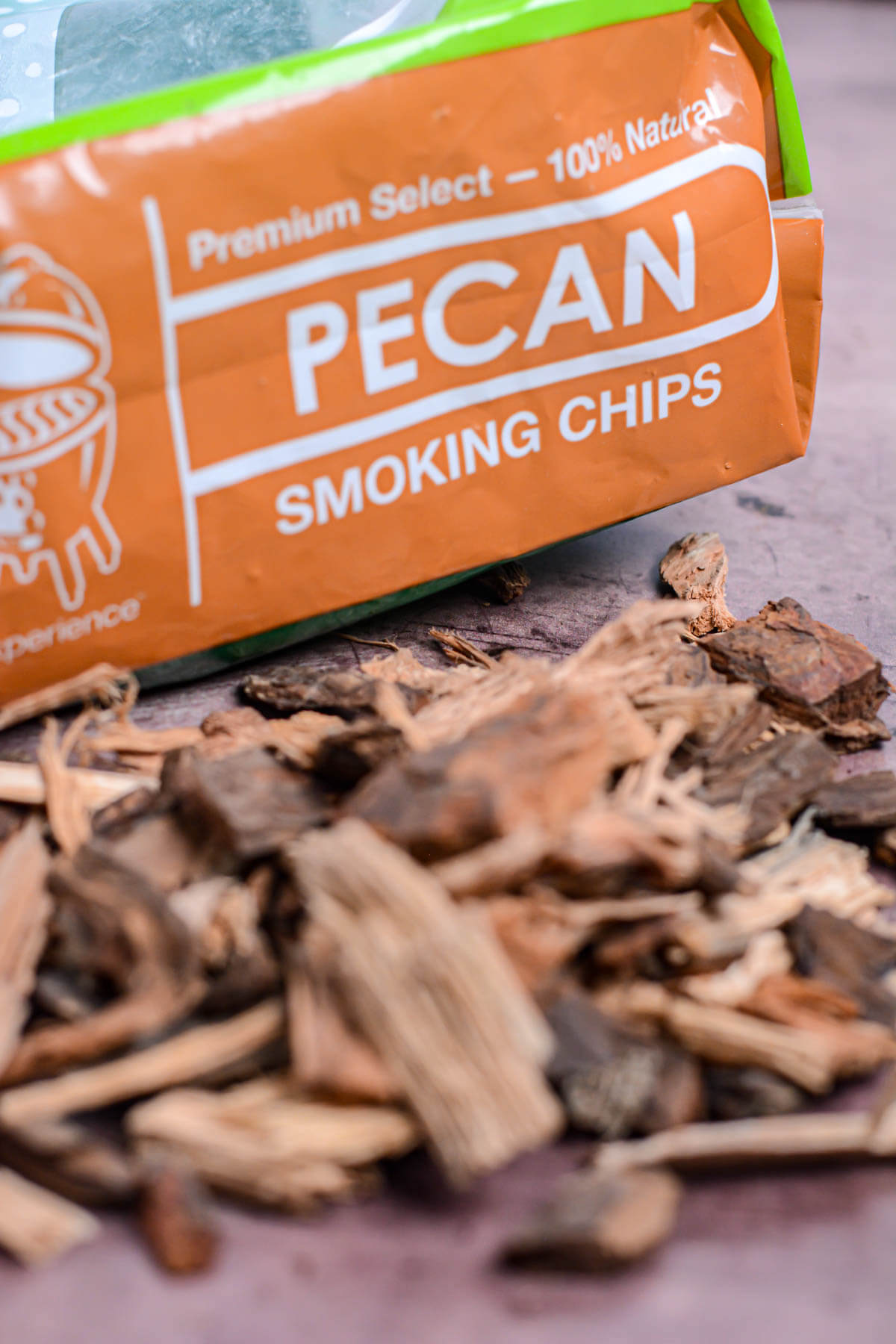 bag of pecan wood chips and a stack of them in front.