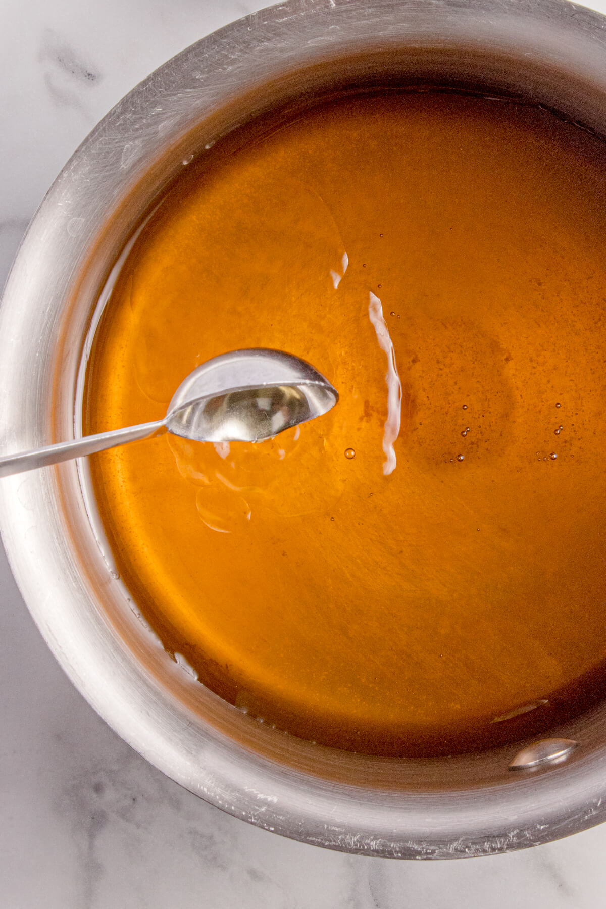 Top view of a small sauce pan with honey.