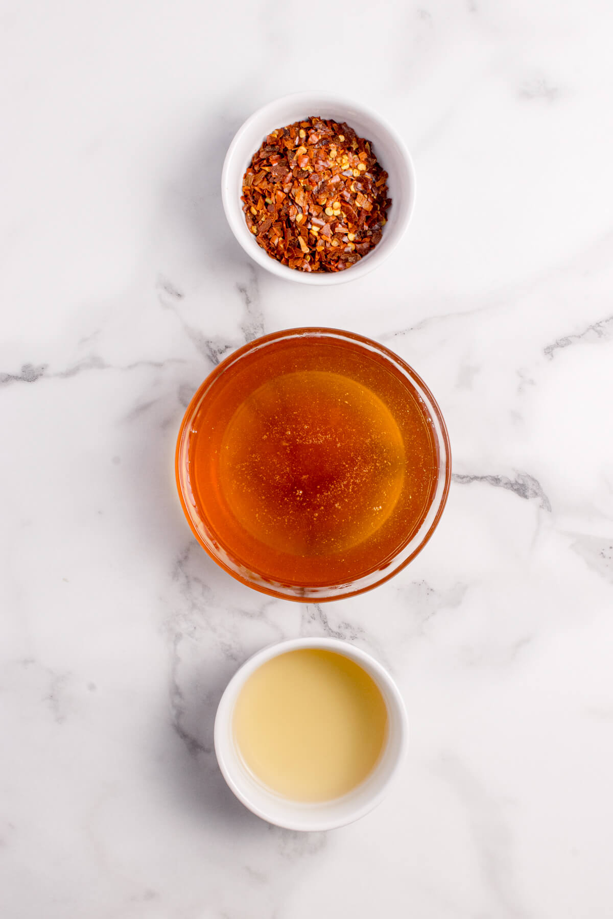 Top view of the three ingredients needed to make the hot honey sauce.